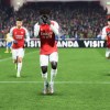 Bukayo Saka hitting the Griddy at Arsenal with teammates around him.