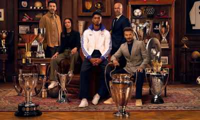 Multiple players posing with trophies.